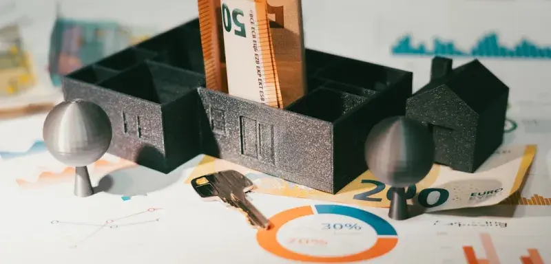 A couple of keys are sitting in a holder