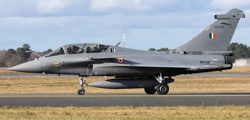 black jet plane on brown field under white clouds during daytime