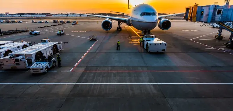 gray airplane on parking