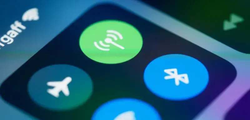Detailed close-up image of a smartphone's control center showing various connectivity icons.