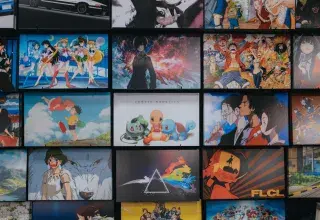 anime character collage photo on black wooden shelf