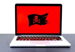 Écran d'ordinateur affichant un message de piratage informatique