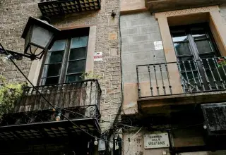 a tall brick building with balconies and balconies