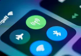 Detailed close-up image of a smartphone's control center showing various connectivity icons.